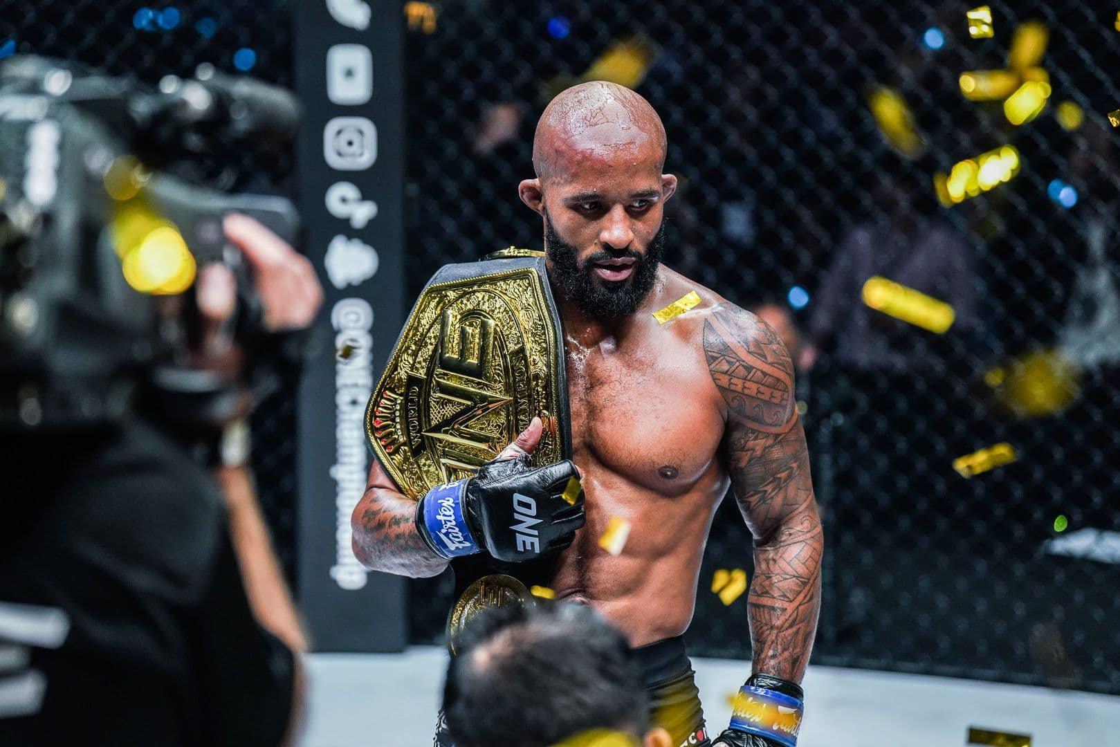 Demetrious "Mighty Mouse" Johnson  after winning the title belt.