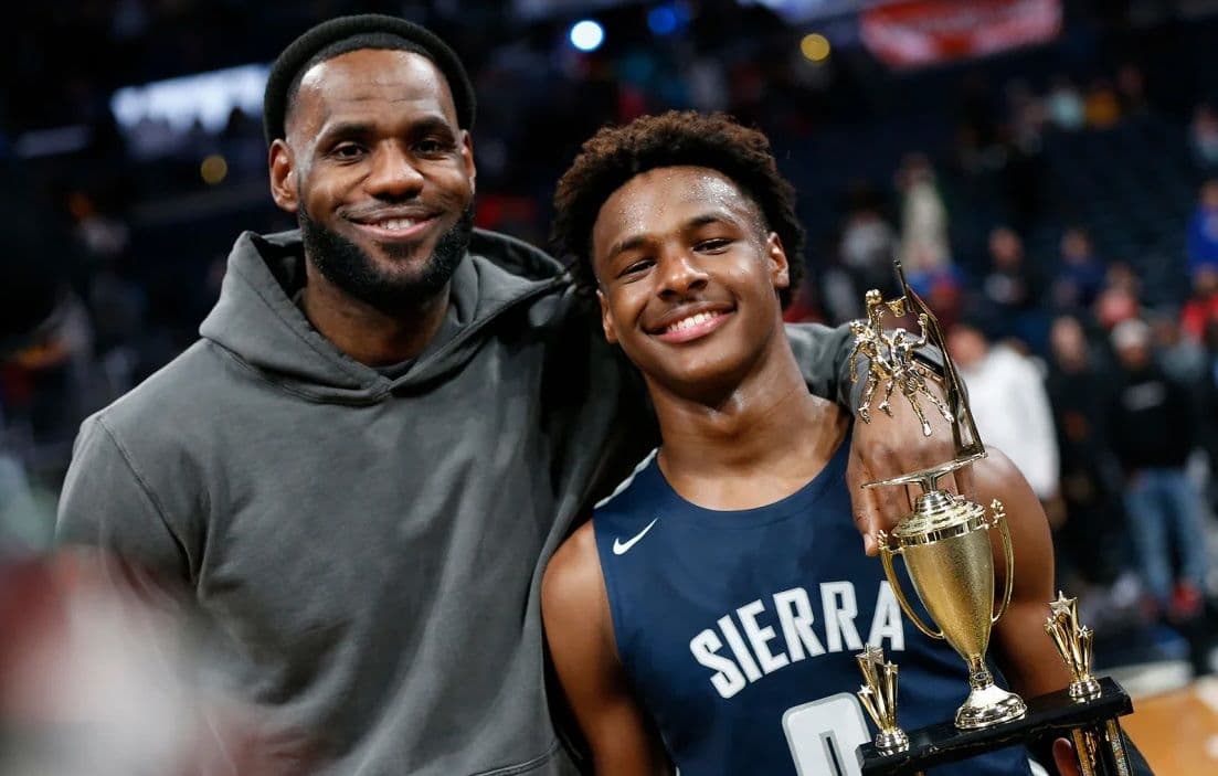 LeBron James poses with his son Bronny after Sierra Canyon beat Akron St. Vincent - St. Mary in a high school basketball game on December 14, 2019, in Columbus, Ohio.